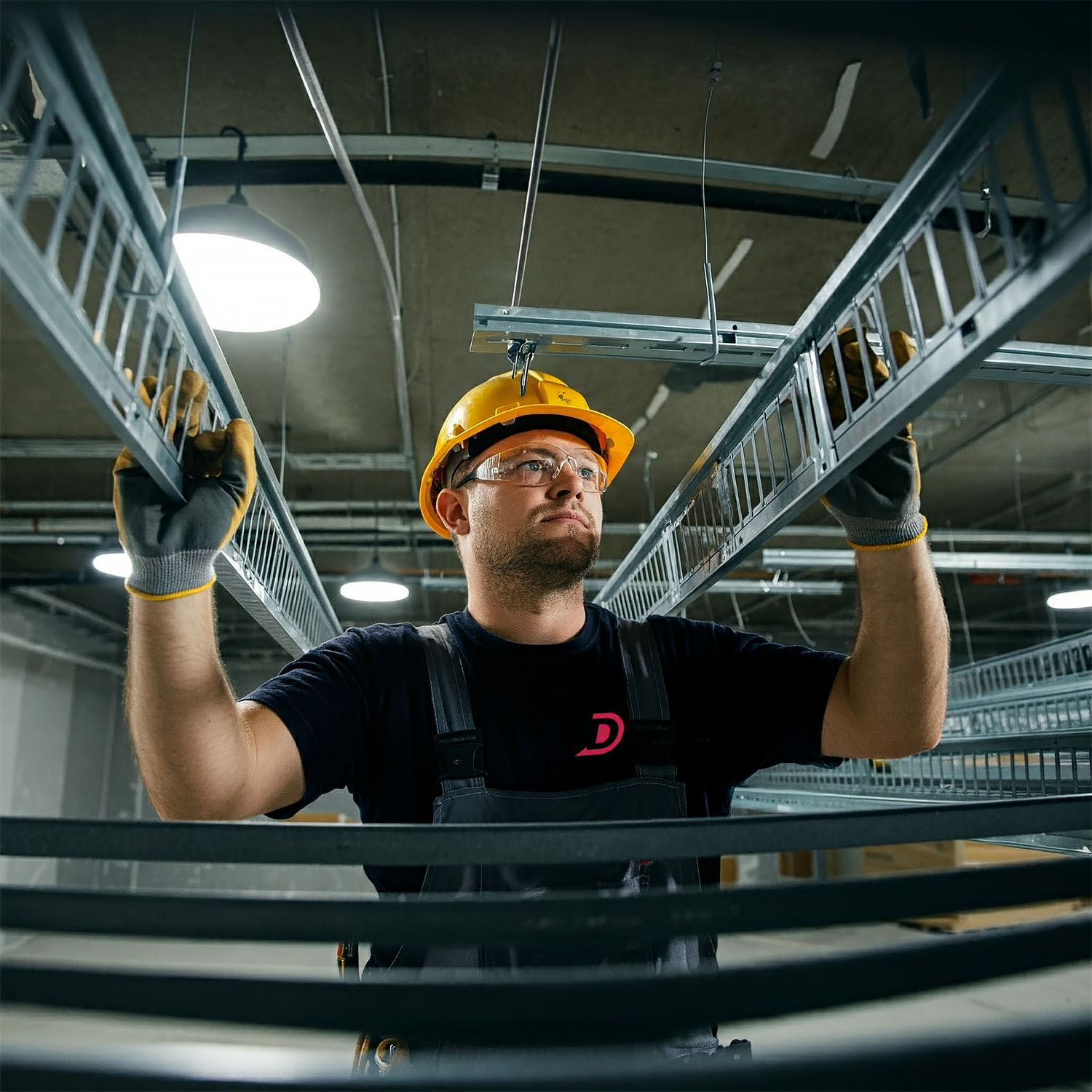 Commercial Electrician hanging and running strut and cable trays